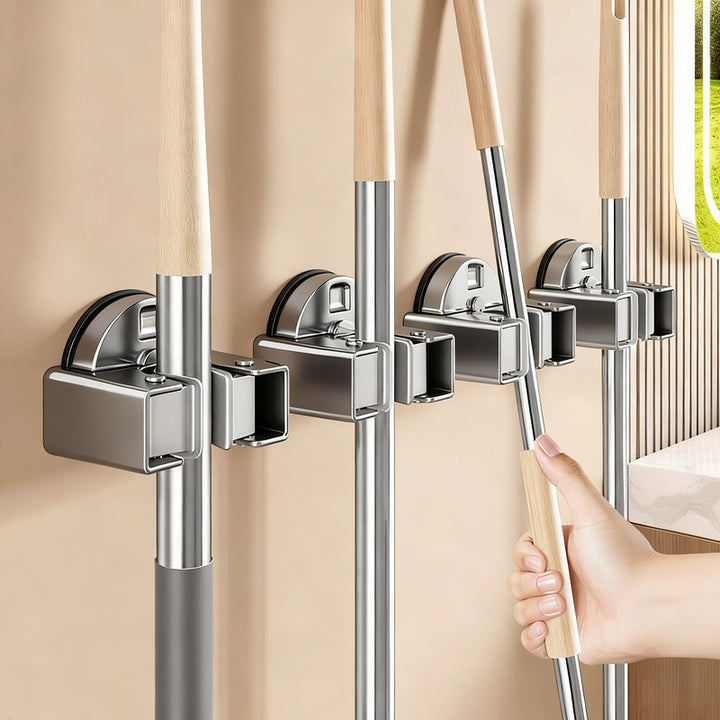 Suction cup holder for brooms and mops