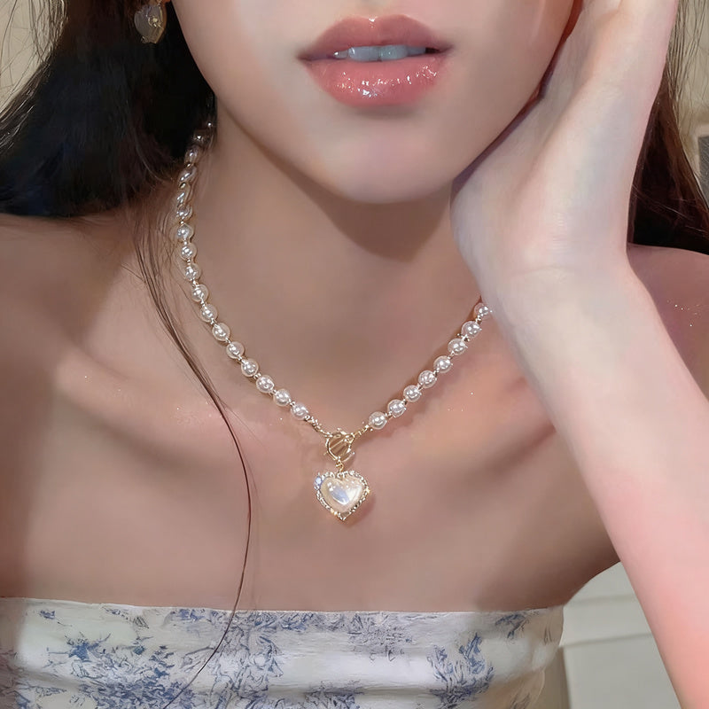 Pearl necklace with silver clasp, pearls 4–12 mm