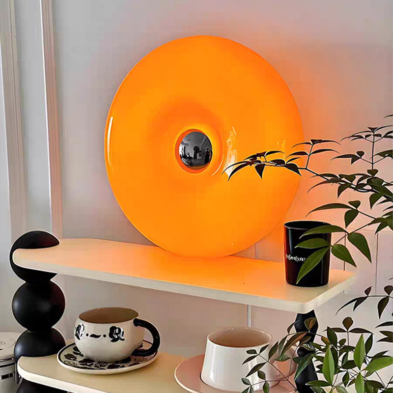 Donut-shaped table lamp with color change