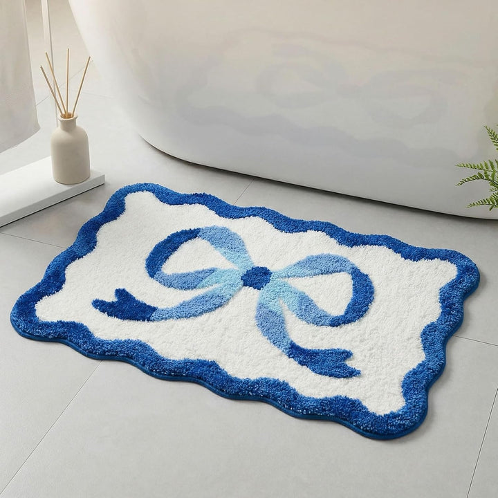 Bath mat with bow motif, synthetic fiber fabric