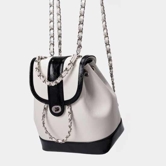 Compact backpack made of PU with chain decoration