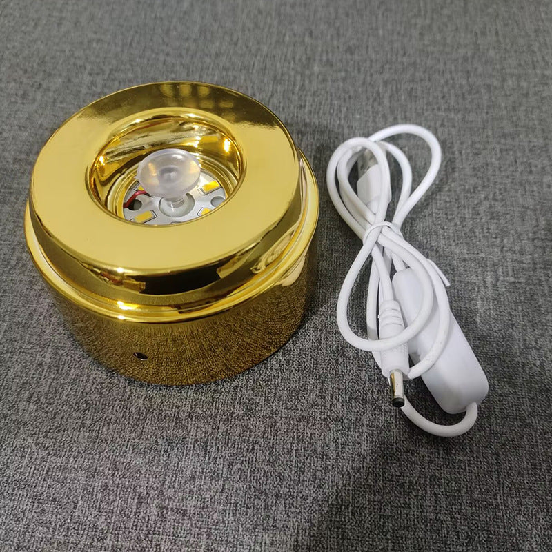 Glowing crystal ball with rotating base
