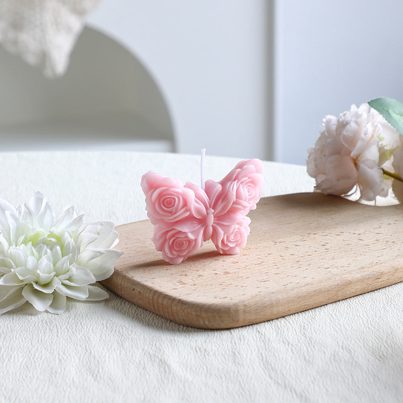 Rose-colored scented candle made from soy wax, handcrafted