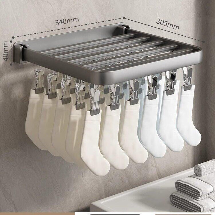 Wall-mounted clothes dryer with clamps