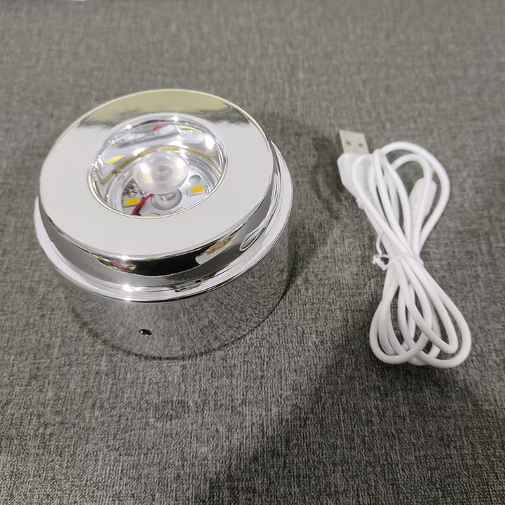 Glowing crystal ball with rotating base