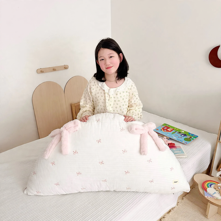 Cotton pillow with bow pattern