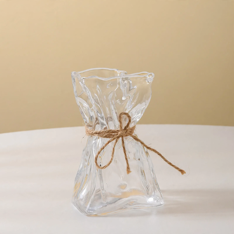 Glass vase with irregular folding pattern
