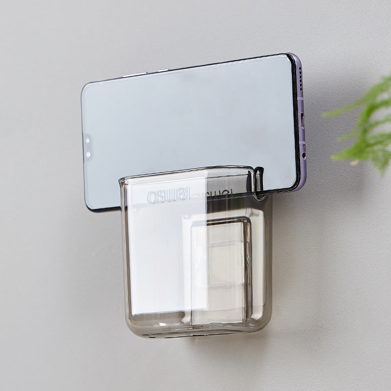 Wall-mounted storage box for remote controls and phones