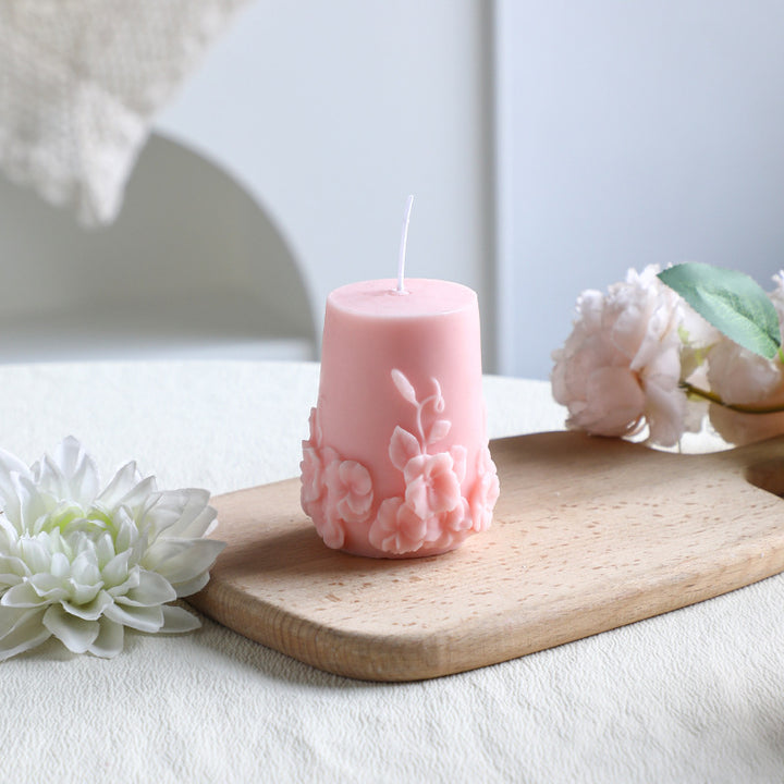 Rose-colored scented candle made from soy wax, handcrafted