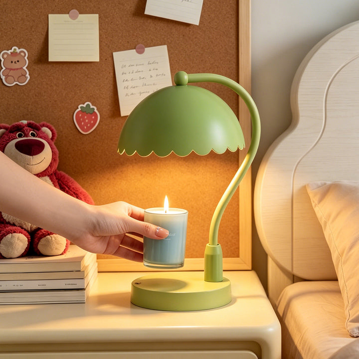 Table lamp with scented candle and lever mechanism