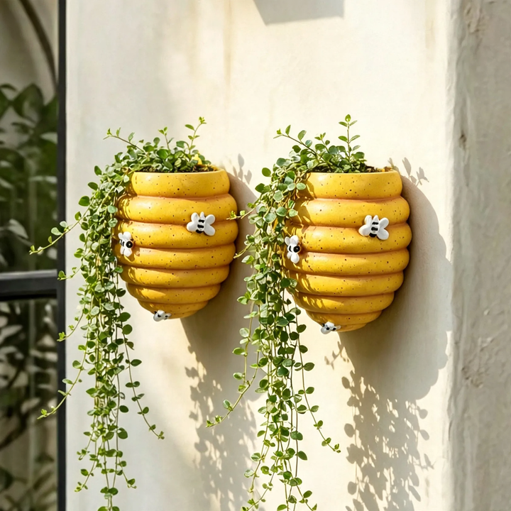 Wall-mounted flower pot with bee motif