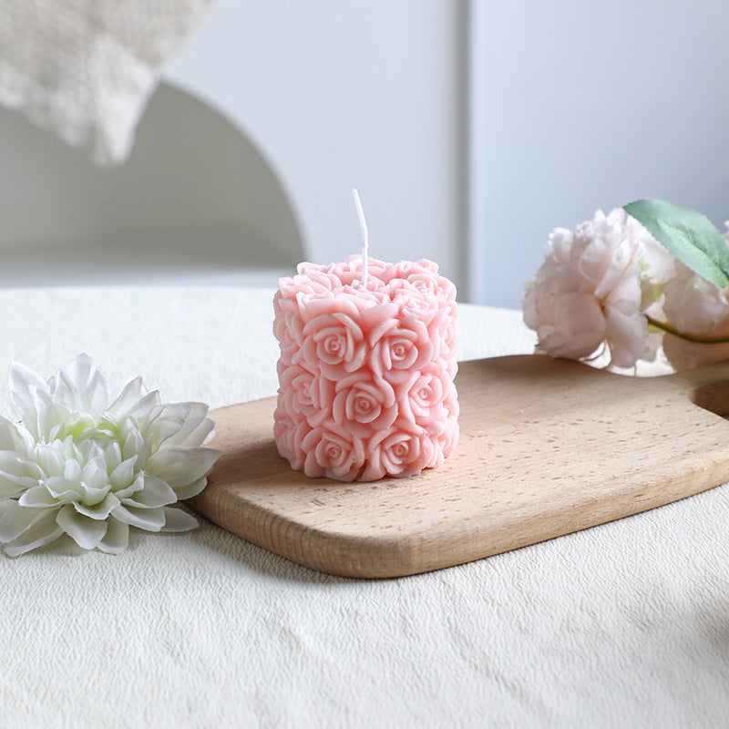 Rose-colored scented candle made from soy wax, handcrafted