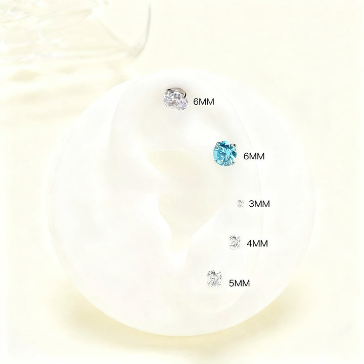 Titanium alloy earrings with zirconia, screw closure