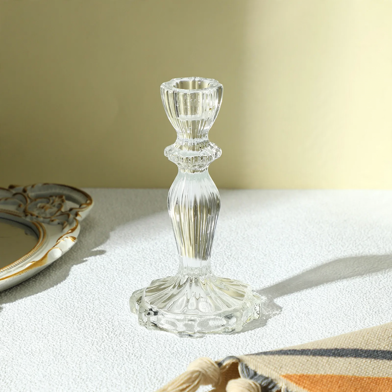 Transparent glass candle holder with structured pattern