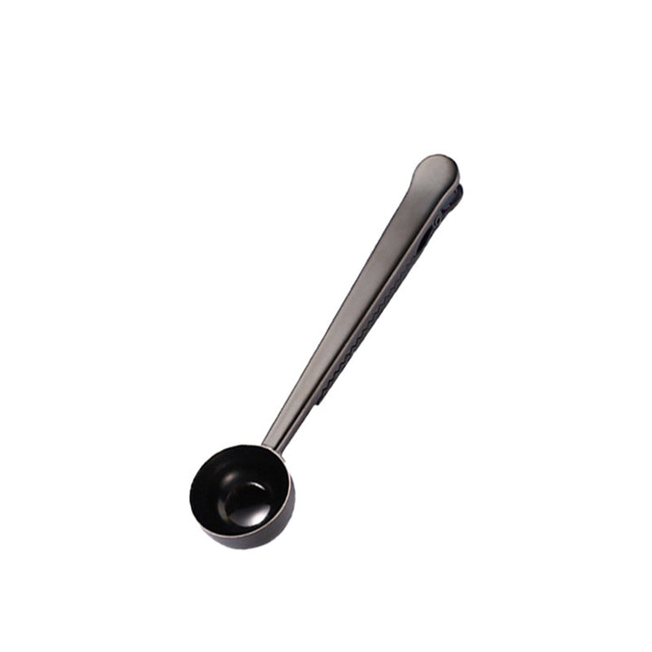 Stainless steel measuring spoons with closure clip