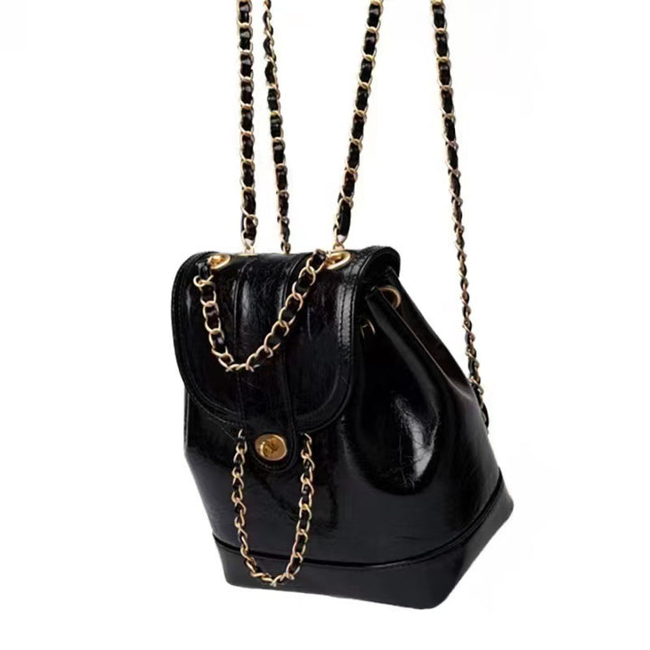 Compact backpack made of PU with chain decoration