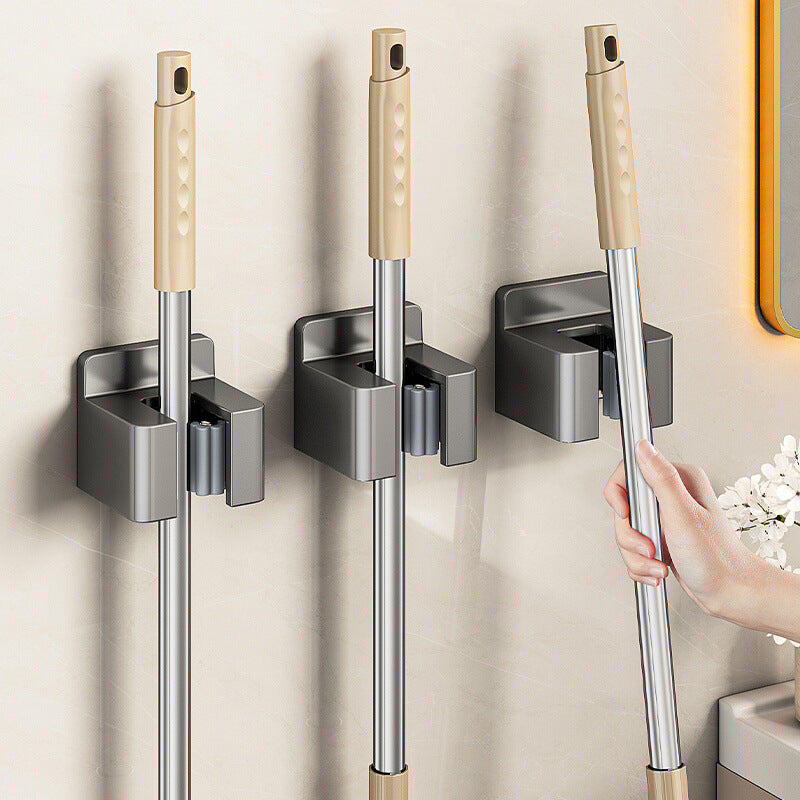 Stainless steel wall holder for brooms and mops