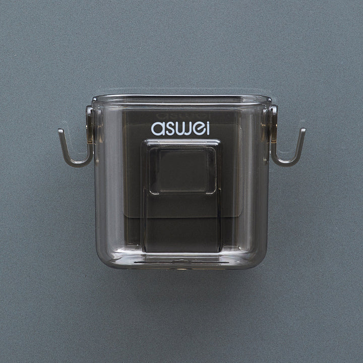 Wall-mounted storage box for remote controls and phones