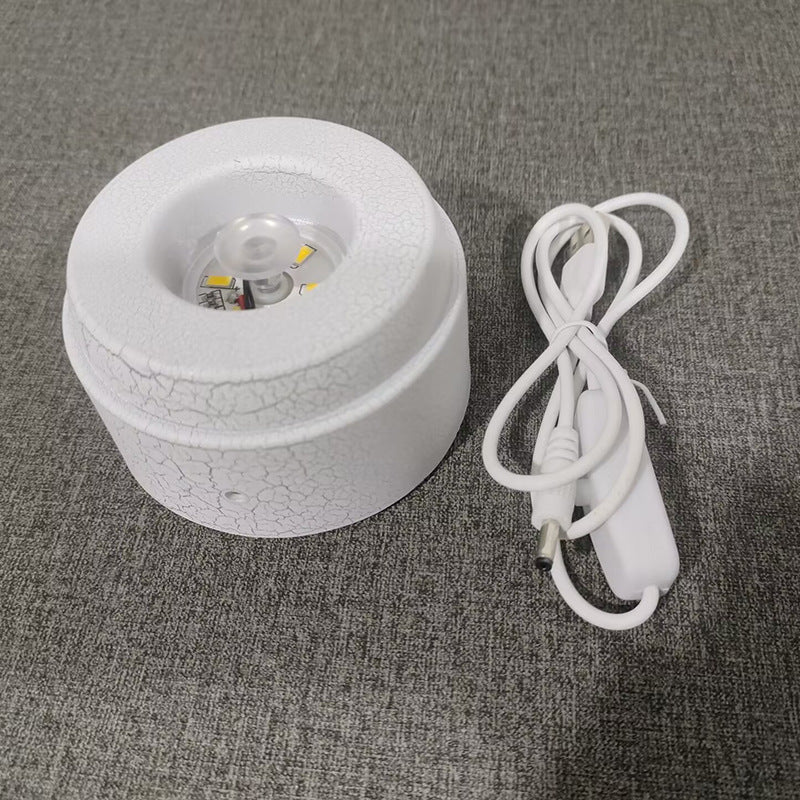 Glowing crystal ball with rotating base