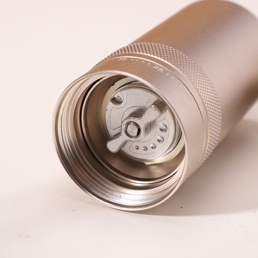 Hand coffee grinder with CNC grinding mechanism and brush
